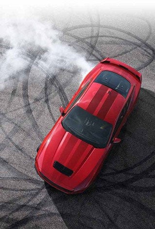 Overhead view of a 2024 Ford Mustang® model with tire tracks on pavement | Matthews-Currie Ford in Nokomis FL